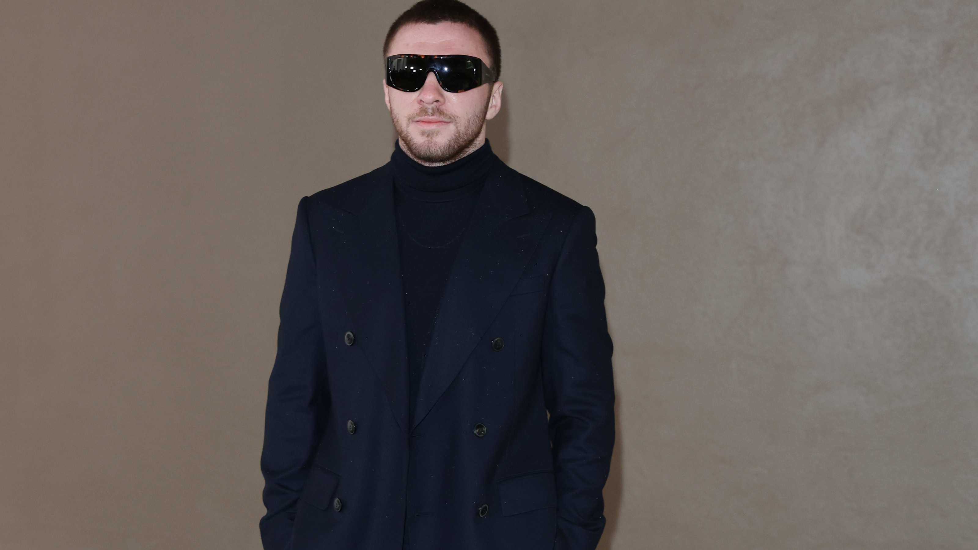 Rocco Ritchie in all black and sunglasses