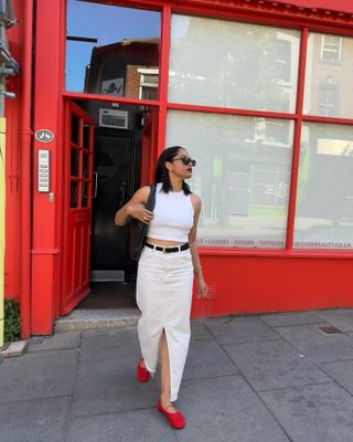 Best classic outfits: @astyleedit wears a white tank top and denim skirt