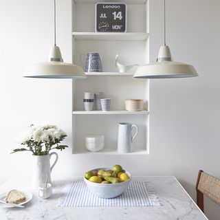 white kitchen with two pendant lights