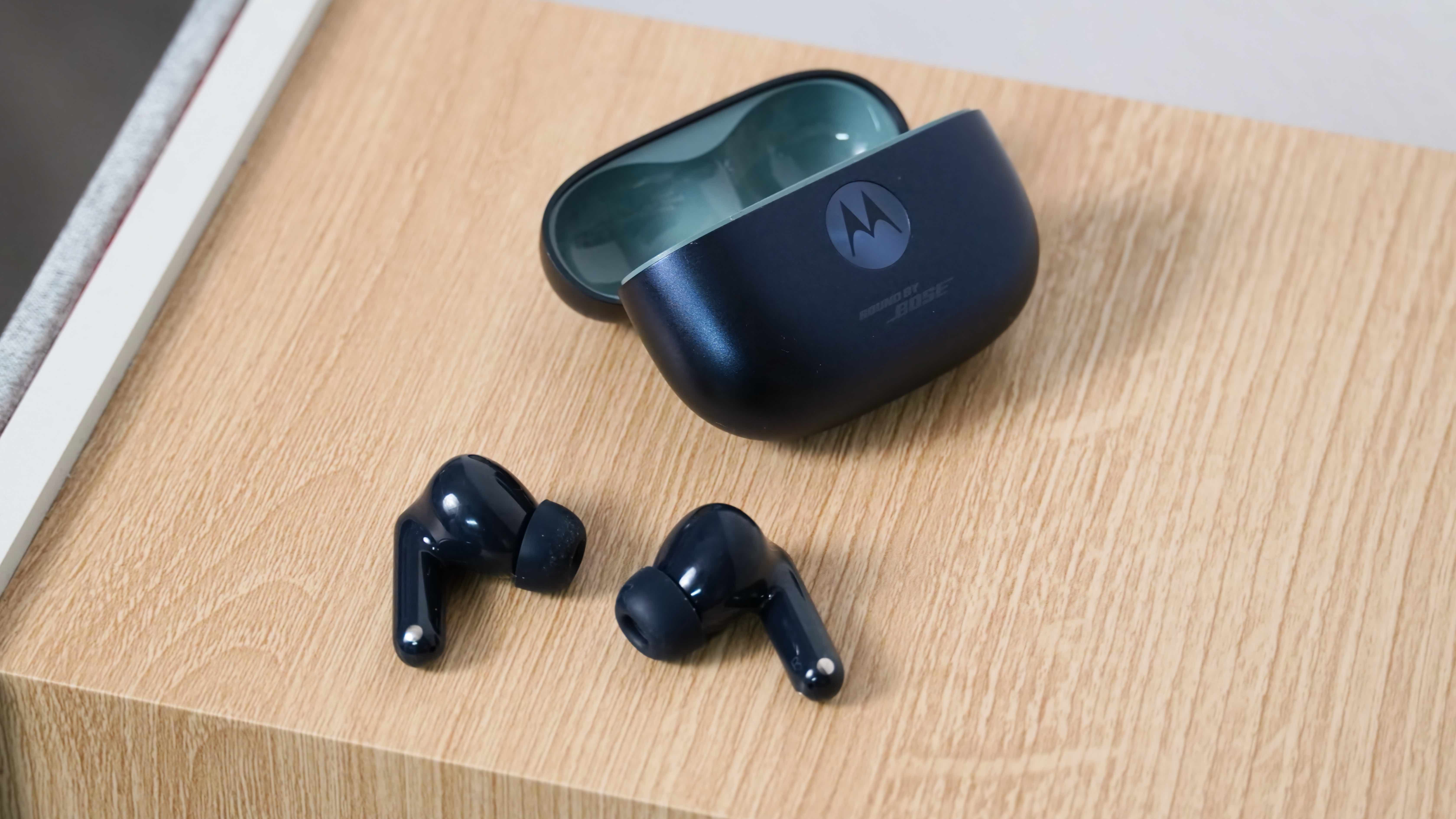 The Moto Buds 2 Plus alongside their companion app showing settings to change to improve audio quality.
