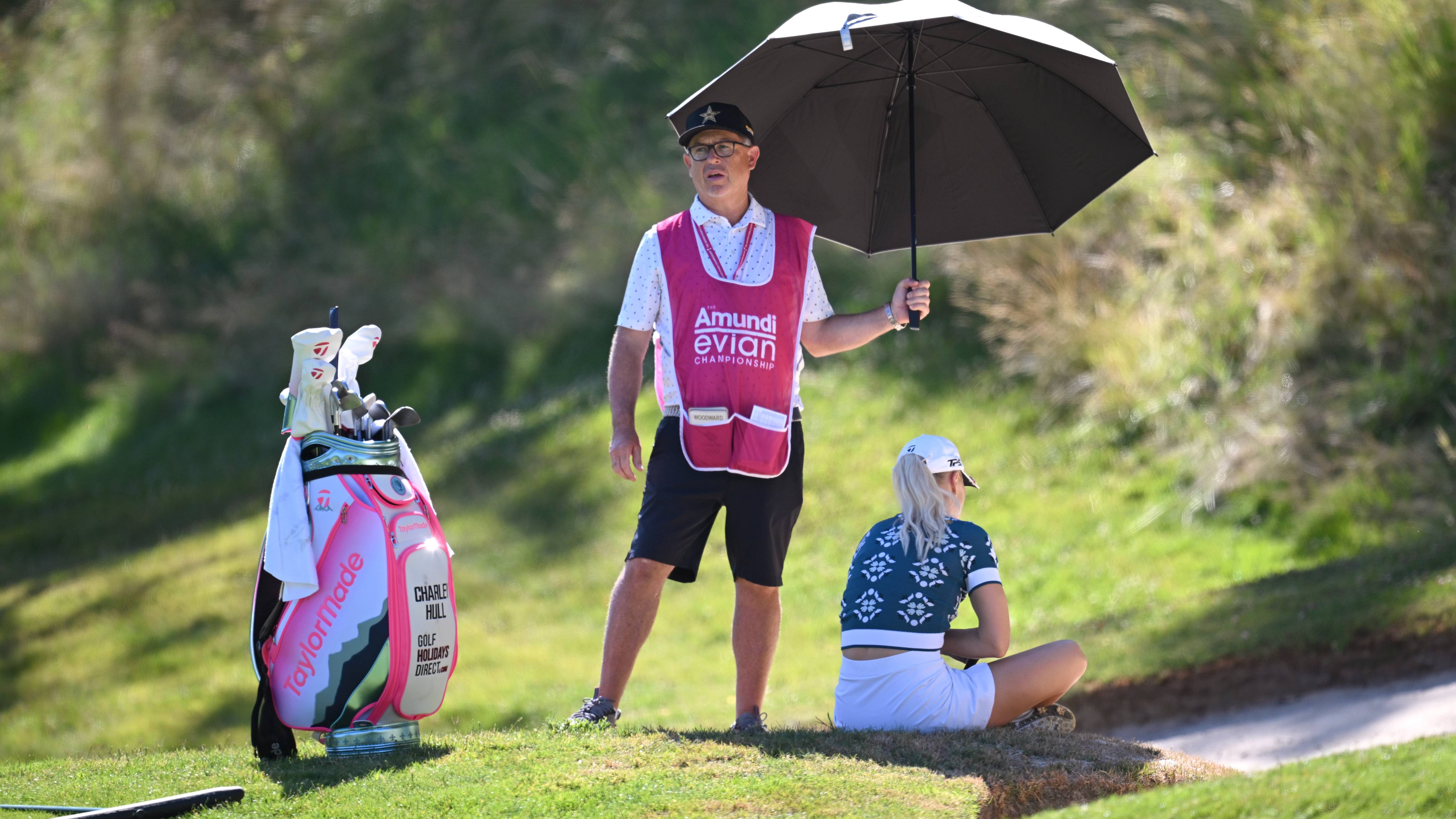 Charley Hull sitting on edge of bunker after falling ill during 2025 Amundi Evian championship