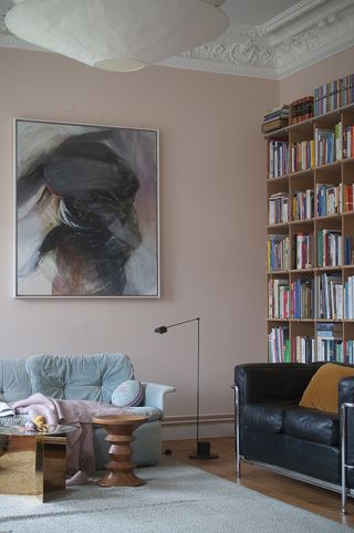 A living room with light pink and light blue