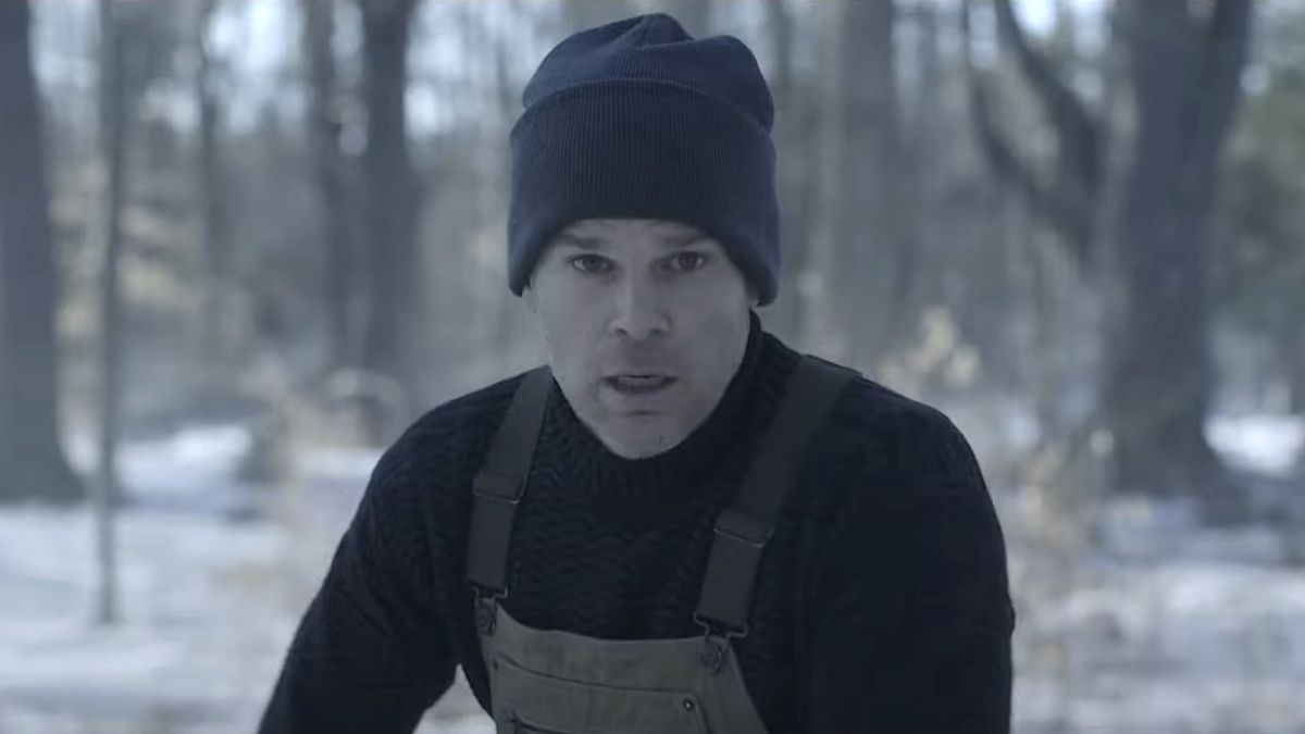 Dexter in overalls and ski cap hunting in snowy woods in Dexter: New Blood premiere