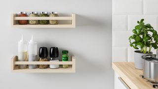 Wooden wall-mounted shelves in kitchen as an alternative kitchen storage idea