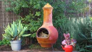 pictuer of chiminea with twigs inside it