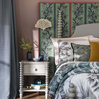 bedroom with bed having fan patterned headboard