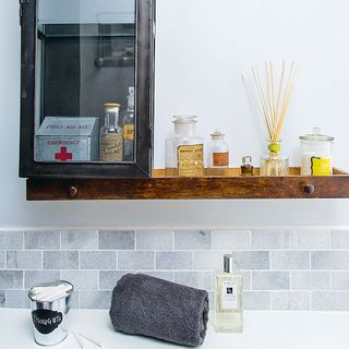 bathroom with second hand furnishings and first aid kit