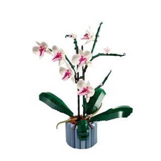 A LEGO orchid flower with green leaves and a blue vase