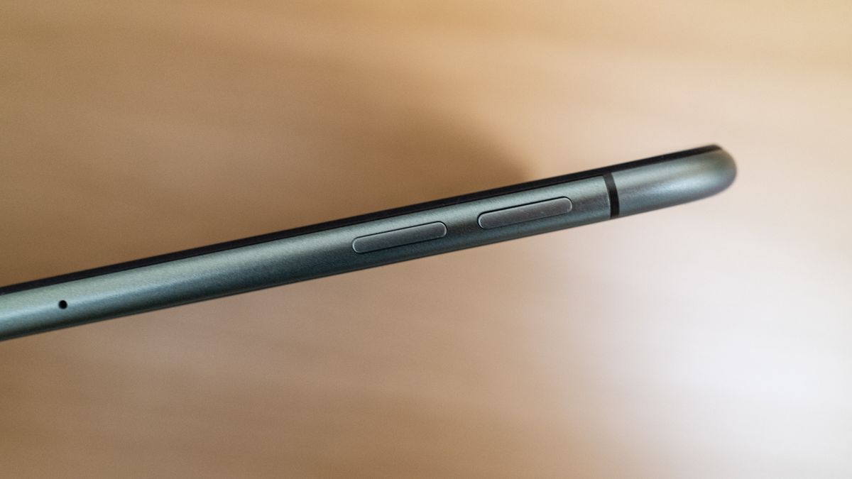 OnePlus Pad Go side on view of the volume buttons on a wooden table