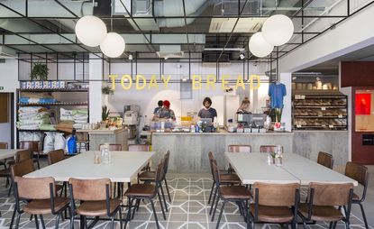 Inside Today Bread showing tables, chairs & food counter