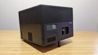 black, boxy outdoor projector on table