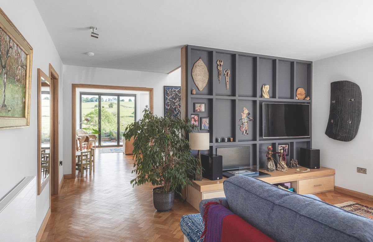 An open-plan living room with TV station