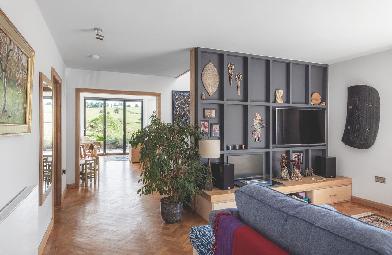 An open-plan living room with TV station