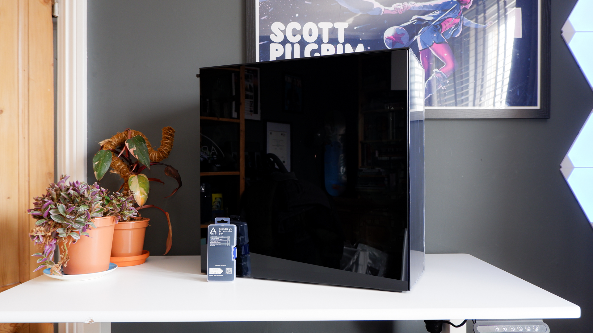 Arctic's Xtender PC case on a white desk with various parts being installed to build a functional gaming PC.