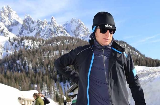 Bradley Wiggins wrapped up against the elements.