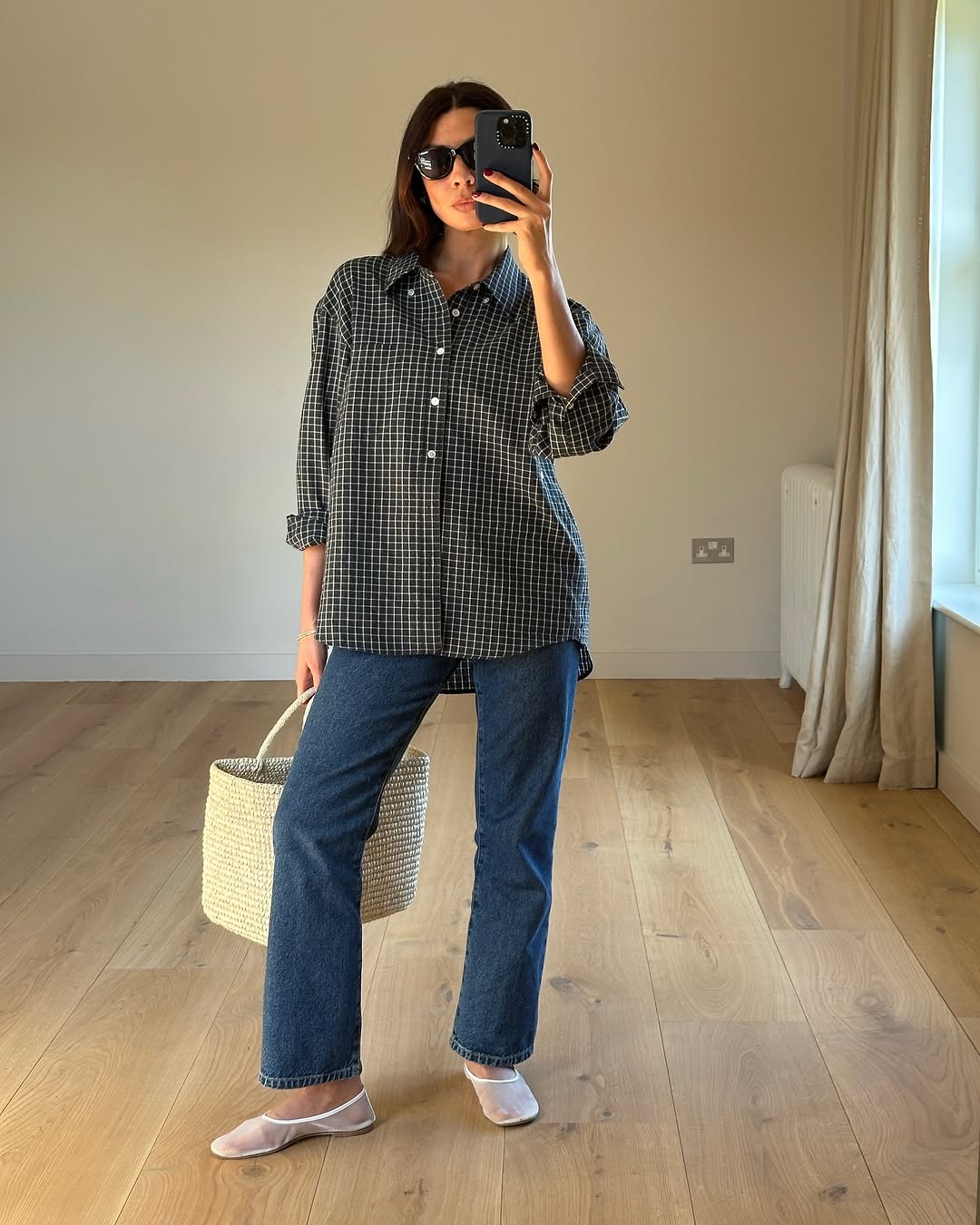 An image of a woman wearing white flats, shoe trend for spring 2026.