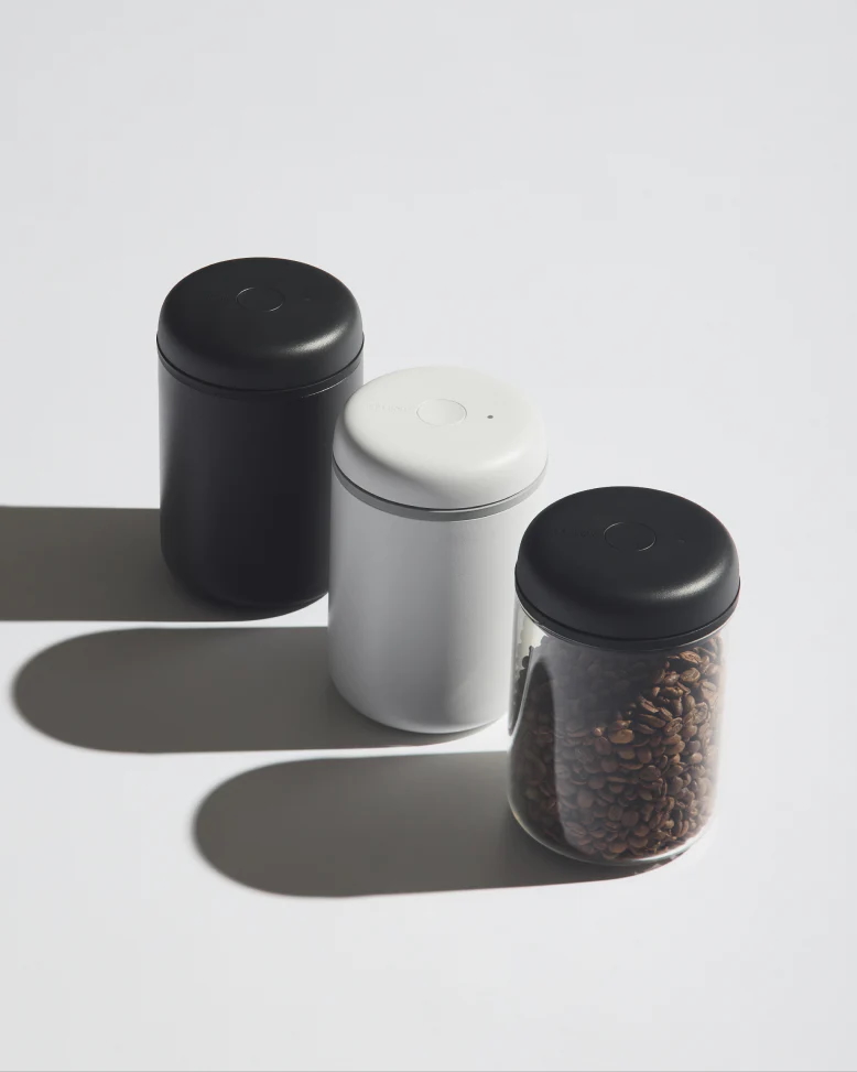 Three Fellow Atmos coffee canisters