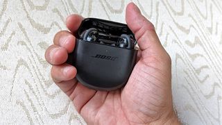 Bose QuietComfort Earbuds 2 in reviewers hand