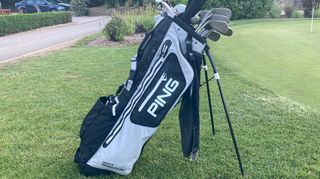 Ping Hoofer Monsoon Stand Bag resting on the golf course