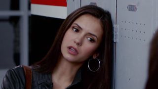 Elena leaning against locker in The Vampire Diaries