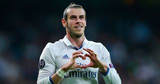 Gareth Bale of Real Madrid celebrates scoring his team's first goal during the UEFA Champions League Group F match between Real Madrid CF and Legia Warszawa at Bernabeu on October 18, 2016 in Madrid, Spain.