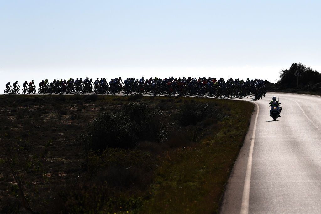 ROQUETAS DE MAR SPAIN FEBRUARY 14 The Peloton during the 34th Clsica de Almeria 2021 a 1833km race from Pueblo de Vicar to Roquetas de Mar Silhouette Landscape ClasicaAlmeria21 on February 14 2021 in Roquetas de Mar Spain Photo by Tim de WaeleGetty Images