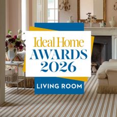 A pink-painted period living room with Alternative Flooring's Wool Candy striped carpet and the Ideal Home Awards 2026 logo on top