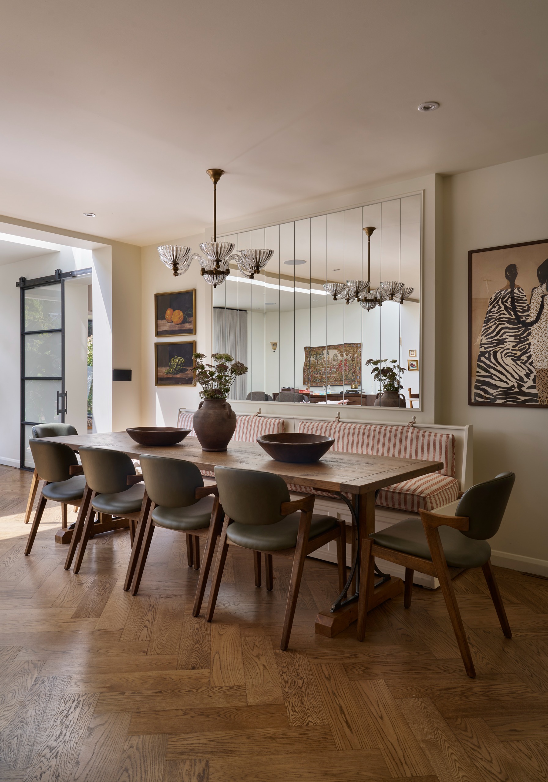 A modern banquette with a mirror behind