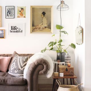 living room with white wall and frames on the wall