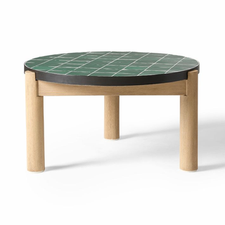green coffee table with wooden legs and tiled top