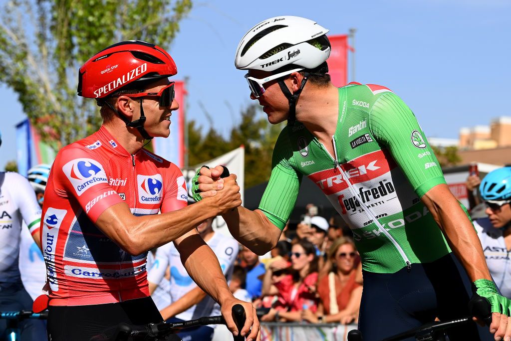 MADRID SPAIN SEPTEMBER 11 LR Remco Evenepoel of Belgium and Team QuickStep Alpha Vinyl Red Leader Jersey and Mads Pedersen of Denmark and Team Trek Segafredo Green Points jersey congratulate each other during the 77th Tour of Spain 2022 Stage 21 a 967km stage from Las Rozas to Madrid LaVuelta22 WorldTour on September 11 2022 in Madrid Spain Photo by Tim de WaeleGetty Images
