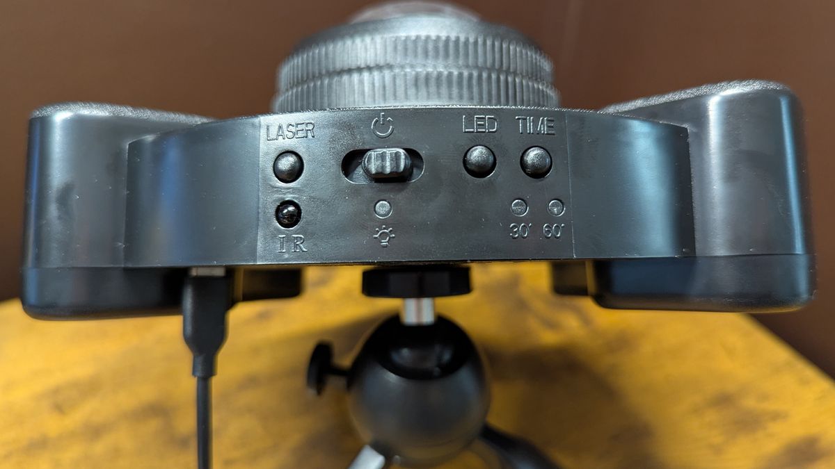 YgiTK Northern Galaxy Lights Projector during Review, on a wooden table against a dark coloured wall
