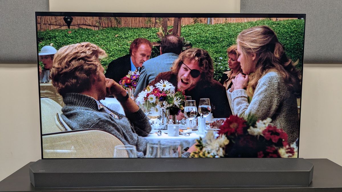 Cutter's Way 4K Blu-ray on LG G5 OLED showing Cutter and Bone sat at a dining table in a restaurant