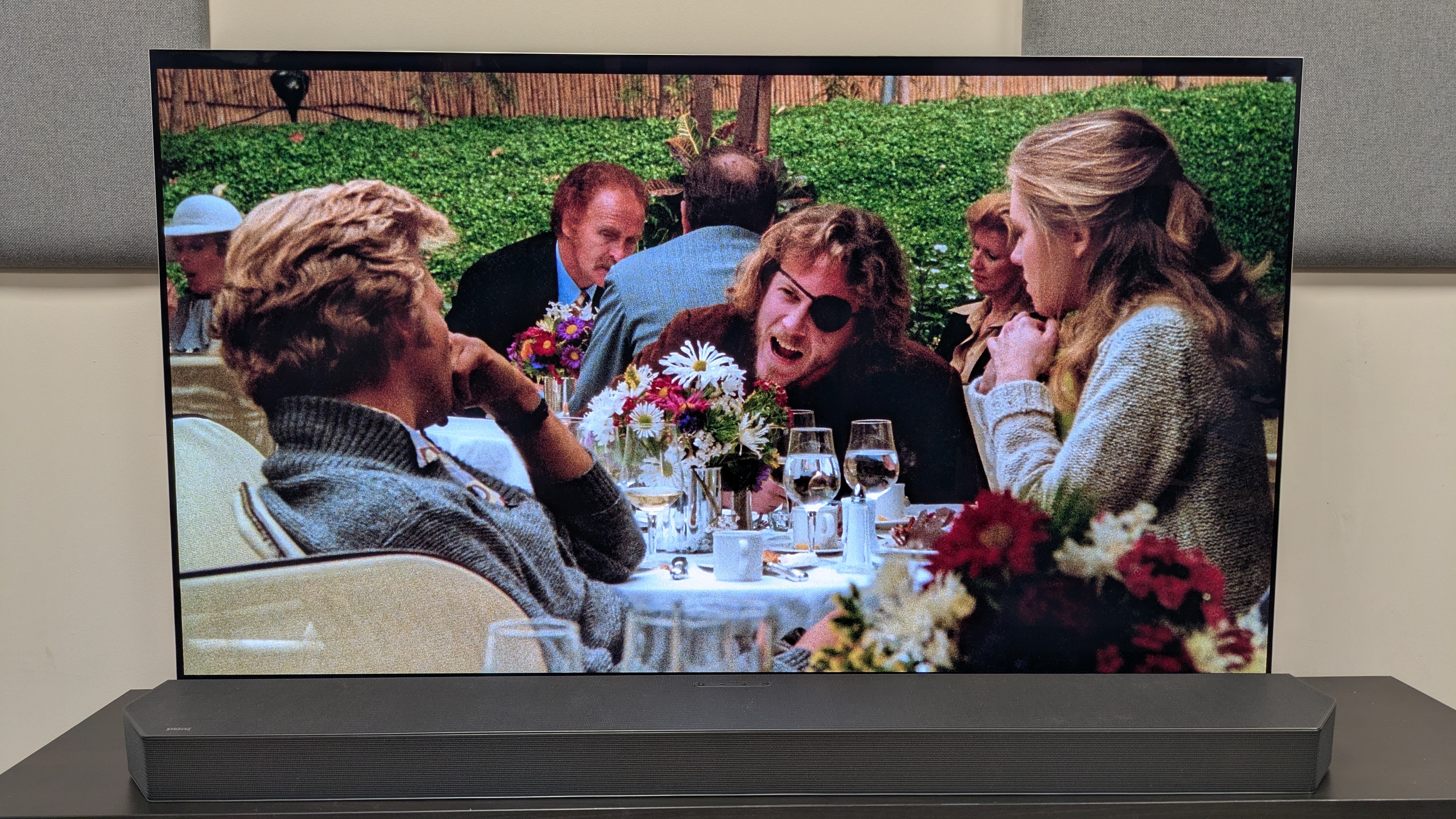 Cutter's Way 4K Blu-ray on LG G5 OLED showing Cutter and Bone sat at a dining table in a restaurant 