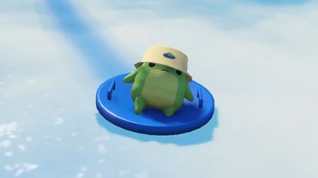 A little frog wearing a hat and riding a sled in Sledding Game