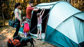 parts of a tent: family setting up