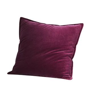 A dark purple velvet square throw pillow