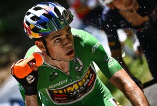 JumboVisma teams Belgian rider Wout Van Aert wearing the sprinters green jersey cools off by spraying water as he cycles in a breakaway during the final kilometers of the 18th stage of the 109th edition of the Tour de France cycling race 1432 km between Lourdes and Hautacam in the Pyrenees mountains in southwestern France on July 21 2022 Photo by AnneChristine POUJOULAT AFP Photo by ANNECHRISTINE POUJOULATAFP via Getty Images