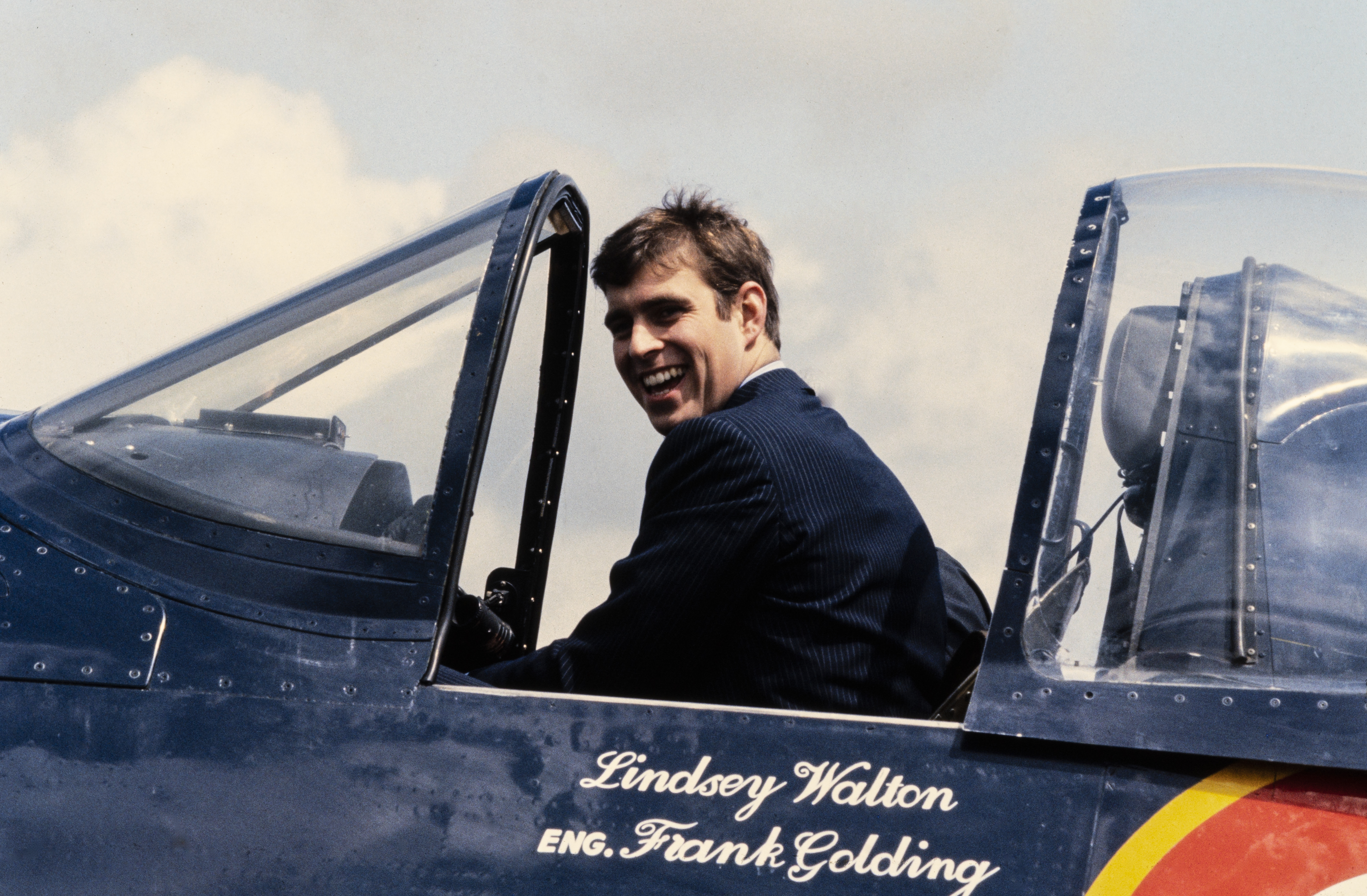 Andrew Mountbatten-Windsor sitting in a plane and laughing