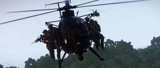 a bunch of Arma 3 players loaded into a little bird helicopter