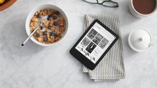 Amazon Kindle (2022) on table next to breakfast cereal