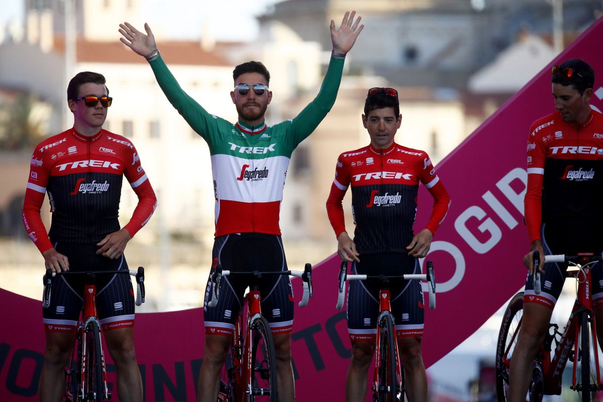 Giacomo Nizzolo waves from the podium
