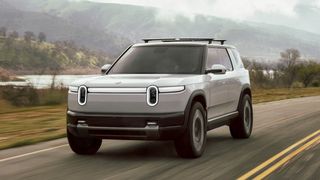 The Rivian R2 EV speeding down a road