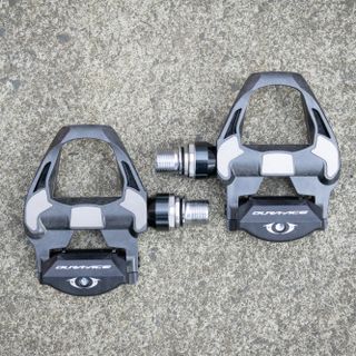 Pair of Shimano Dura-Ace clipless pedals on the ground 