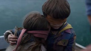 Two children wearing blindfolds on a boat during the trailer for the Netflix horror movie, Bird Box.