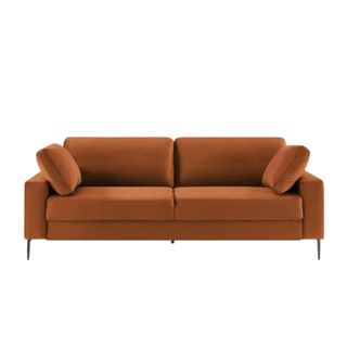 A brown two-seater velvet couch with two pillows and metal legs