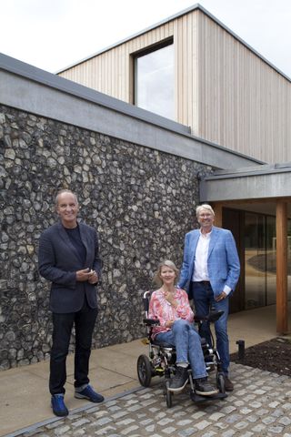 The couple with Kevin McCloud outside the property
