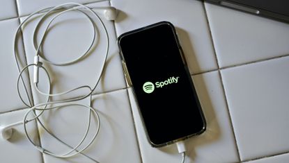 phone with spotify on the screen