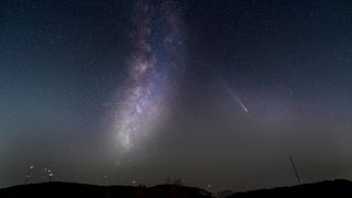 a bright white, fuzzy streak in the night sky