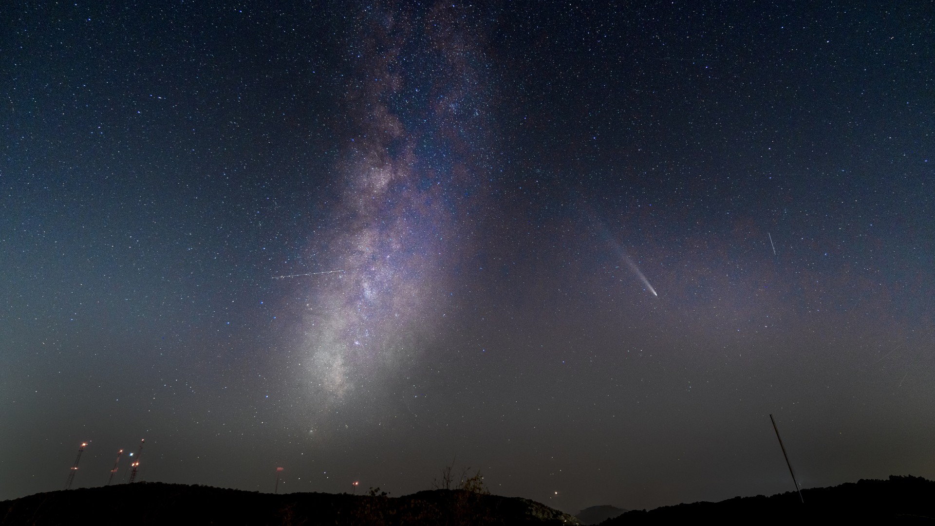 a bright white, fuzzy streak in the night sky